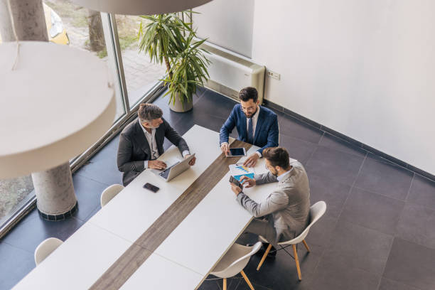 istock Businessmen working together at the office using digital tablet and laptop 2204615772