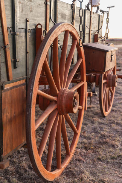 istock Spoked wooden wheel on an old chuck wagon. 2204615962
