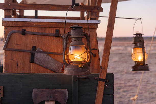 istock Kerosene lanterns hanging on an old chuck wagon. 2204615975