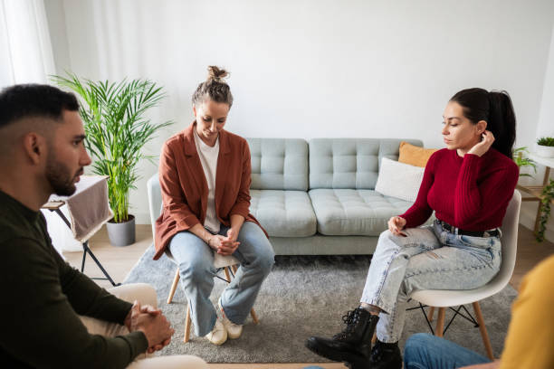 istock Patients listening during group therapy session for mental health issues 2204616691