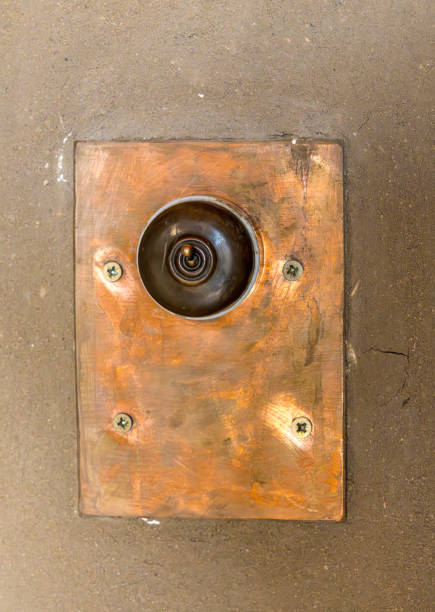 istock Antique toggle electric switch mounted on concrete plaster wall 2204617341