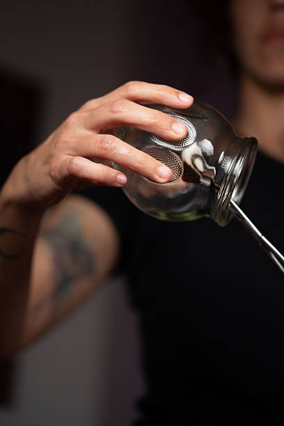 istock masseur's hand holding cup for application to patient 2204619325