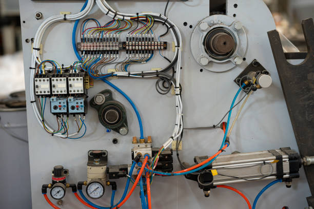 Detailed close-up view of a panel displaying a complex array of wiring and circuits, showcasing the intricacies of electronic configurations.