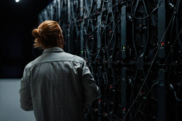 istock Technician examining the back of a large led screen wall 2204625597