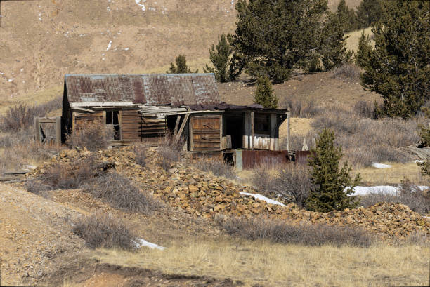 Mines of Goldfield Colorado in winter with the Sangre de Cristo mountain range in the background.