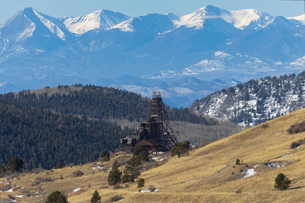 Mines of Goldfield Colorado in winter with the Sangre de Cristo mountain range in the background.