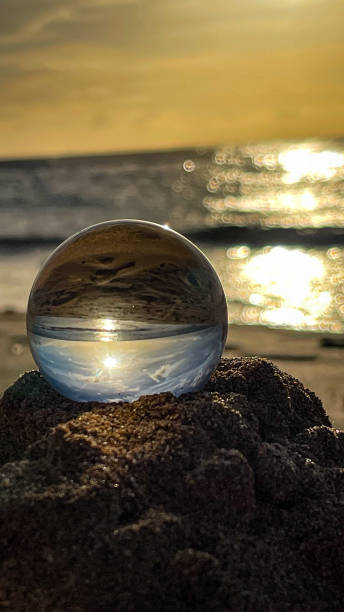 istock Crystal ball reflecting the ocean in Maui Hawaii 2204634835