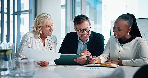 istock Accounting, office and business people with notebook, analysis and manager for discussion, meeting and graphs. Papers, teamwork and talk with tablet, growth strategy or project report for finance 2204636174