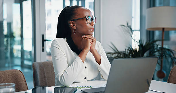 istock Business, thinking and black woman with laptop, ideas and internet with problem solving, planning and decision. Person, employee and magazine editor with pc, connection and choice for article 2204636202