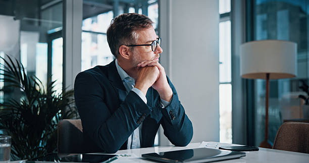 istock Business, thinking and man in office, solution and decision for career growth, doubt and problem solving. Person, employee and consultant in workplace, laptop and planning with choice and options 2204636237