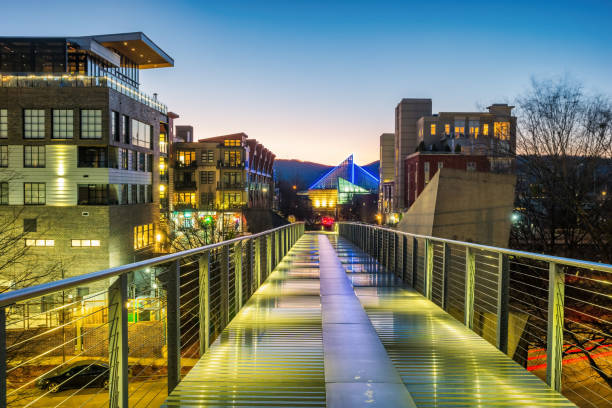 Pedestrian bridge, condos and hotel in downtown Chattanooga Tennessee USA at night