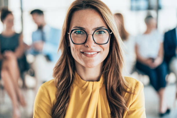 istock Confident businesswoman and her team 2204638504