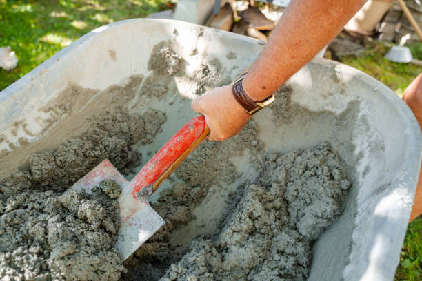 istock Mixing Concrete in a Wheelbarrow 2204639182