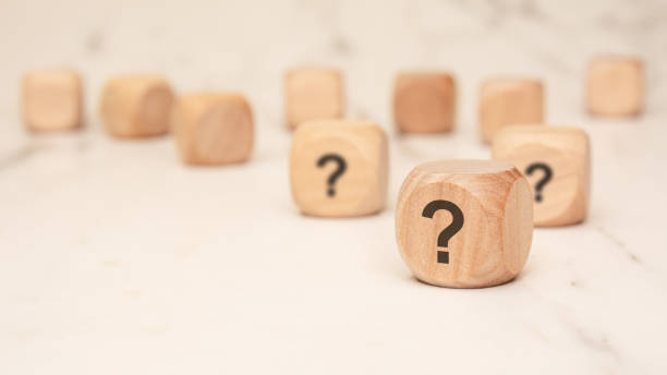 istock wooden blocks with question marks symbolizing uncertainty, decision-making, and strategic choices 2204639830