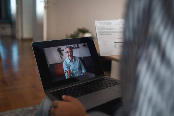 istock Woman having a virtual meeting with her business advisor 2204640002