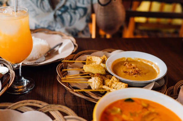 istock Indonesian Vegan Satay with Peanut Sauce on Wooden Table 2204641397