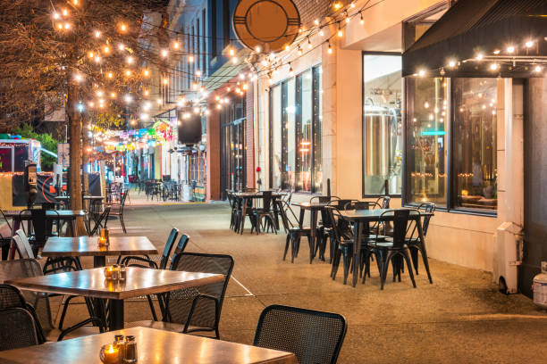 Sidewalk restaurant patios in downtown Macon, Georgia, USA at night