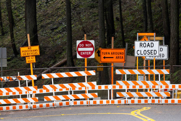 Road closed signs and barriers on the historic Columbia River Highway 30 in Oregon.