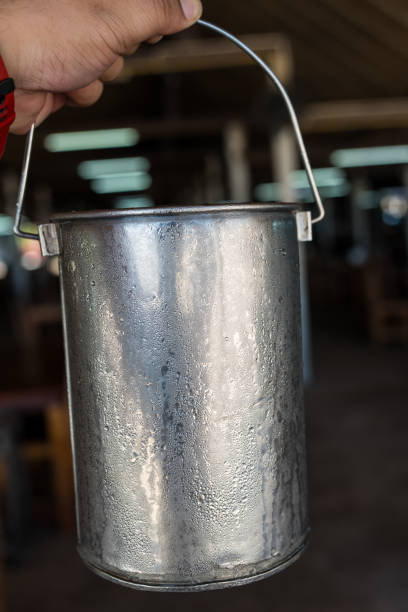 istock Hand holding a metal ice bucket 2204649438