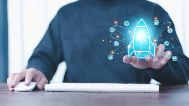 istock Startup business start-up with technology background as a rocket image conveying the idea of ​​launching a well-planned new business. 2204652472