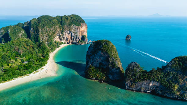 istock Discover Railay Beach in Krabi, Thailand, with its emerald waters and towering cliffs 2204653707