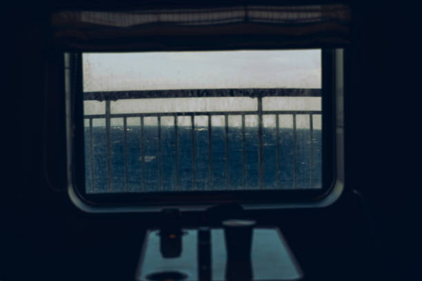 Ocean is seen out the window of a boat