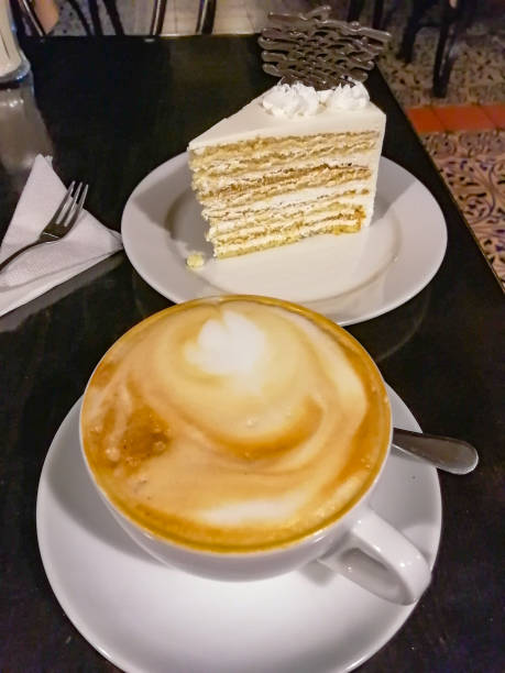 A cup of aromatic coffee with a delicate and delicious dessert