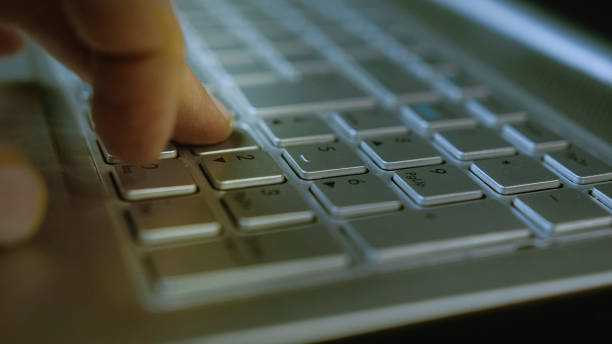 istock Typing password on laptop keyboard, secure login process, cybersecurity concept, close-up shot of finger pressing keys 2204662800