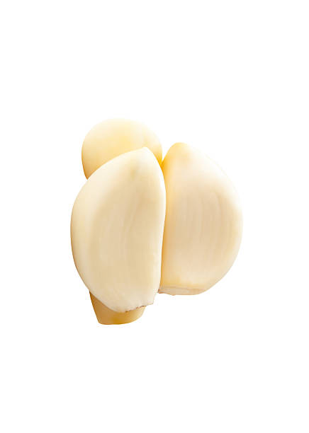 istock Side view of peeled garlic cloves or pieces in stack isolated on white background with clipping path 2204663454