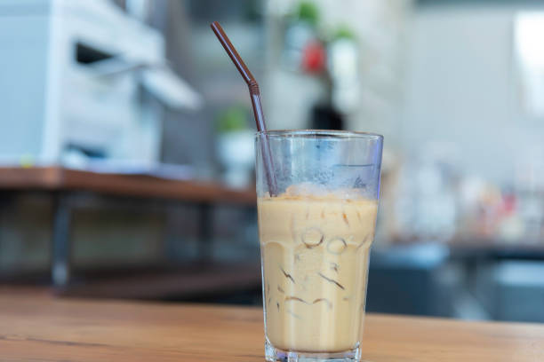 Iced coffee on wooden counter bar