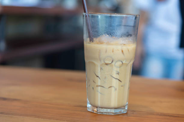 istock Iced coffee on wooden counter bar 2204664162