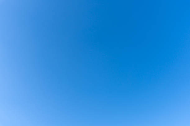 istock Low angle view and full frame of beautiful light blue sky without clouds in the morning or afternoon on sunny day used as natural background texture in decorative art work 2204664471