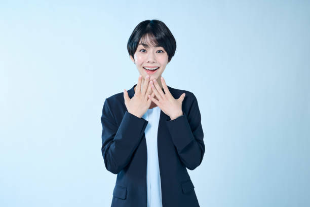istock A female office worker with a happy expression on her face 2204666362