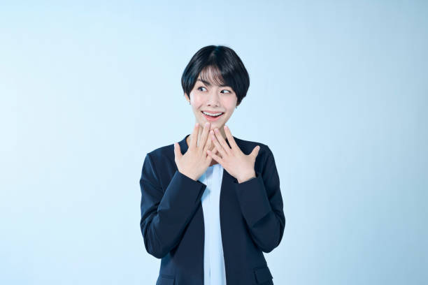 istock A female office worker with a happy expression on her face 2204666562