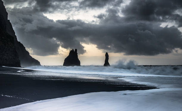 istock Rugged coastline and dramatic clouds in Vik, Iceland during golden hour light 2204667810