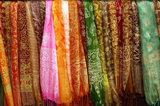 istock Colourful traditional shawl hanging in a market. 2204668909