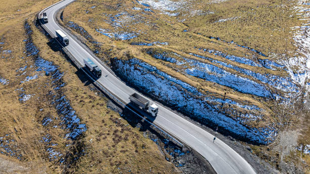 istock Aerial view  on the road surrounded by winter Landscape view 2204670063