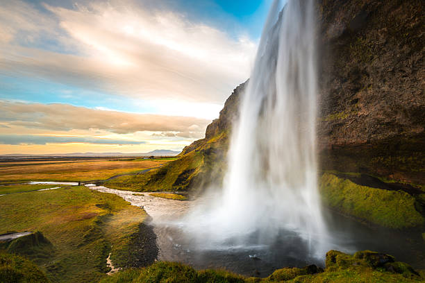 istock Majestic Seljalandsfoss waterfall cascading down Iceland's lush landscape at sunset 2204670346