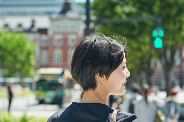 istock A female office worker in her 30s walking through a business district 2204671268