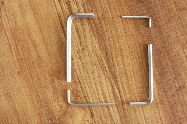 istock Combination hex wrench Steel. Working tools on wooden background. repair, construction 2204672424