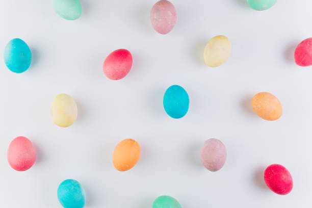 istock Preparation for Easter. olored eggs on a blue background, flat lay and top view. 2204676233