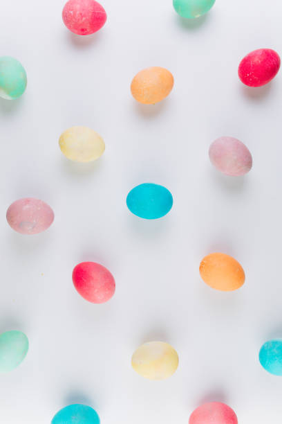 istock Preparation for Easter. olored eggs on a blue background, flat lay and top view. 2204676237