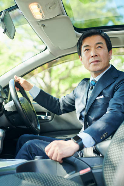 istock A 50-something office worker who drives a car 2204680612