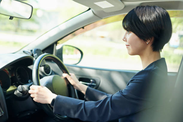 istock Female office worker in her 30s who drives a car 2204681462