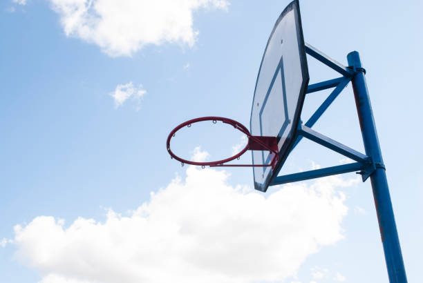 istock Basketball hoop and blue sky 2204682999