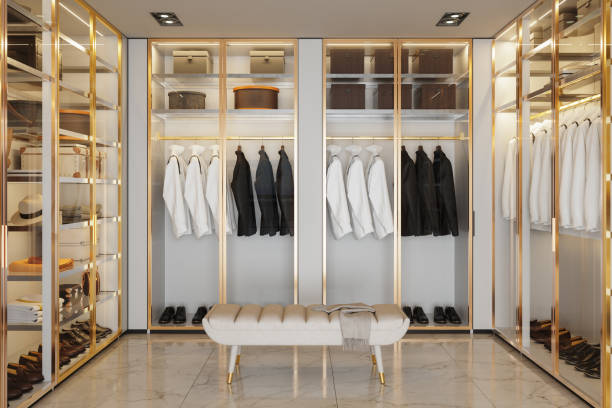 istock Modern Walk-In Closet With Hanging Jackets And Shirts In Wardrobe 2204683125