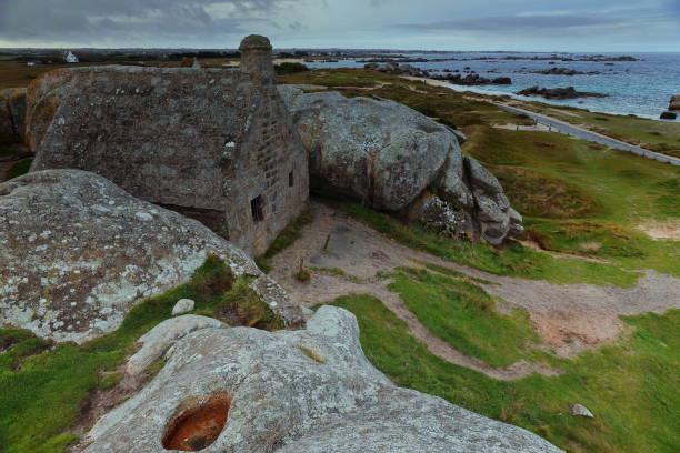 istock Former guardhouse of Meneham -Menez Ham- hamlet built between two huge rocks facing Plage du C'hi Du Beach in Kerlouan commune. Brittany-France-286 2204684256