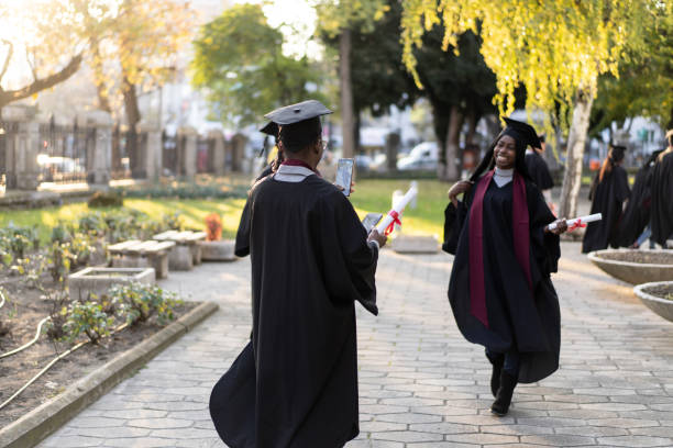 istock Smiling graduates are greeting each other after the ceremony 2204685663