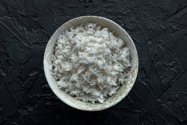 istock White rice, cooked. A bowl of boiled long grain rice, a simple side dish 2204687104