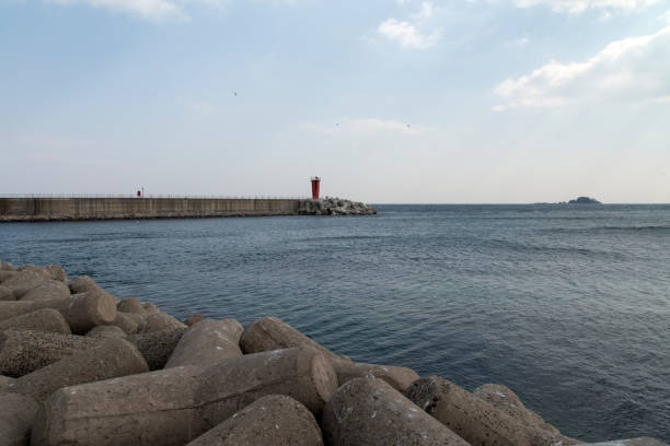 istock lighthouse and sea at the harbor 2204691914